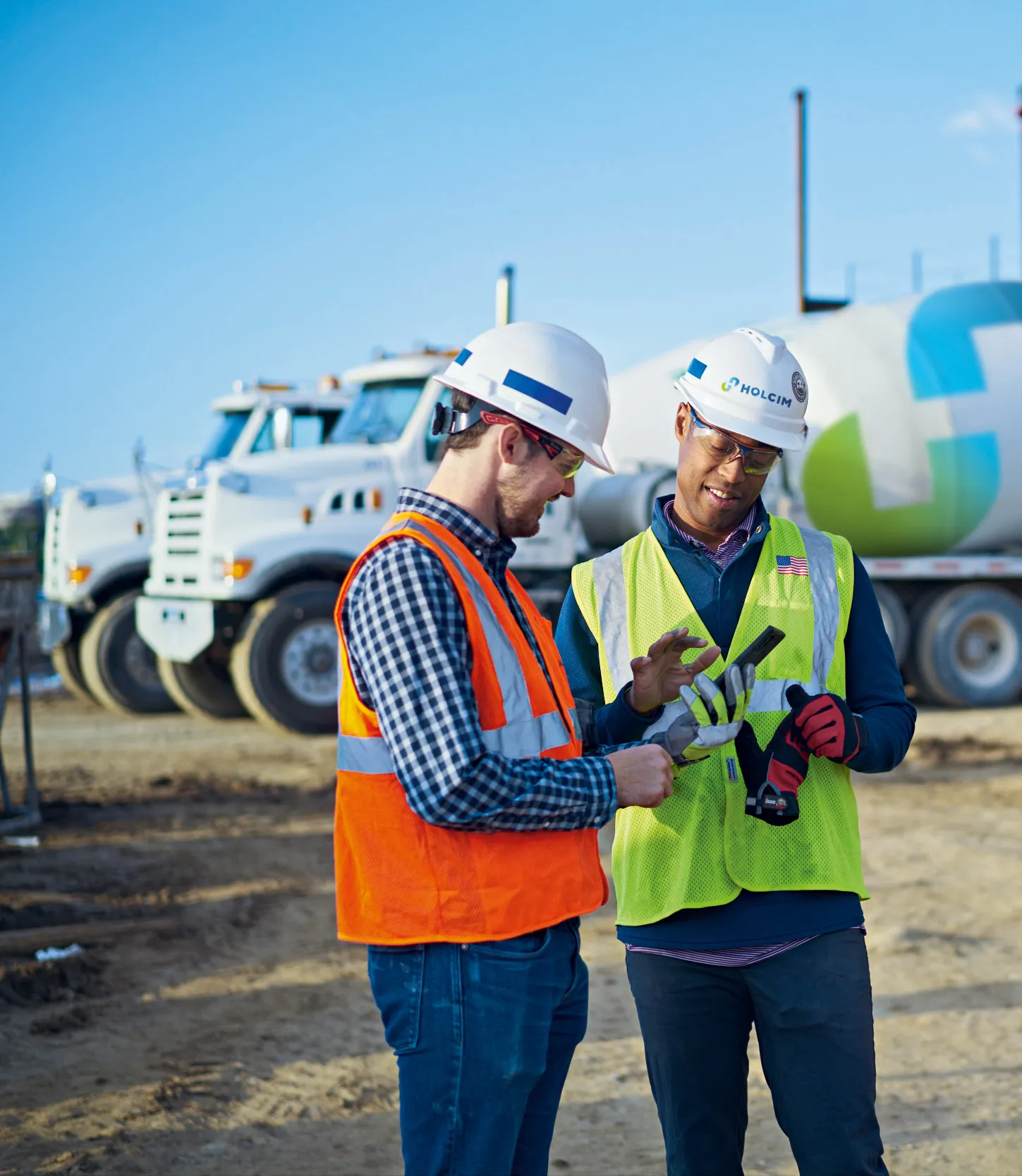 Two men at construction site with concretedirect app