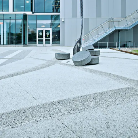 outside warrior stadium, concrete hockey pucks